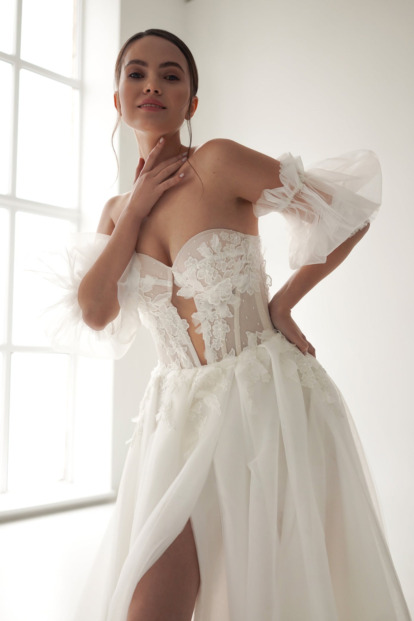 Romantic Tulle Wedding Gown with Floral Lace Bodice, Elegant Poet Sleeves, and Dreamy Long Train