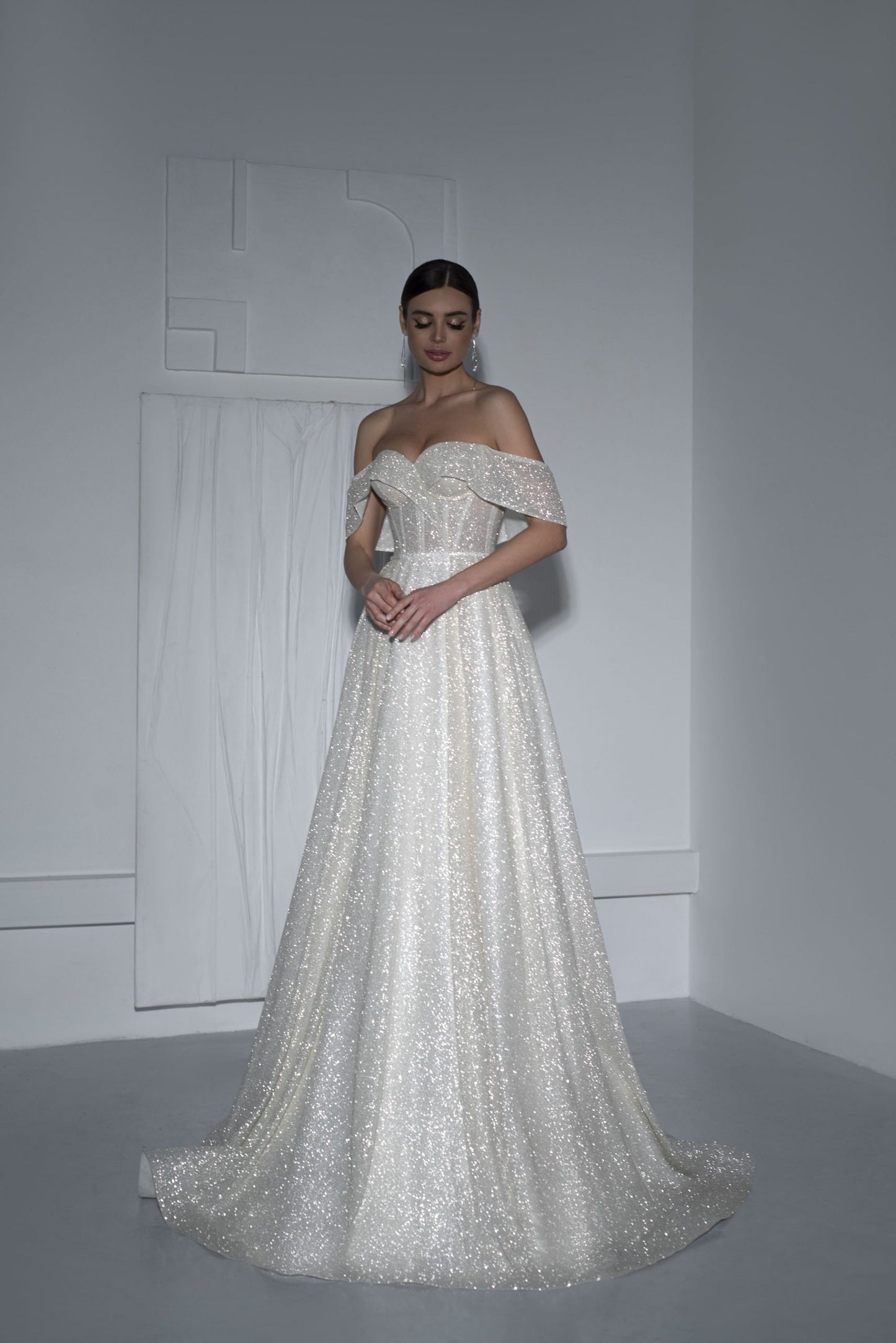 Wedding dress, Splendor, Sophistication,  Glitter fabric, Open shoulders, Elegance,  Refined fashion, Graceful lines, luxury, Admiration.