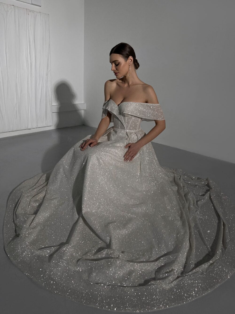 Wedding dress, Splendor, Sophistication,  Glitter fabric, Open shoulders, Elegance,  Refined fashion, Graceful lines, luxury, Admiration.